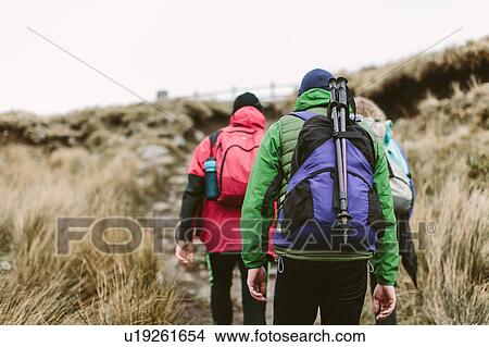 Hikers crossing moor, Yorkshire Dales National Park, England View Large Photo Image Picture - Hikers crossing moor, Yorkshire Dales National Park, England. Fotosearch