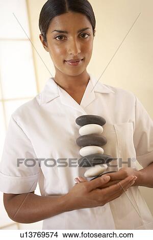Picture - Hot Stone therapy. Fotosearch