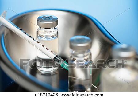 Injectable medications. Kidney dish with injectable medications in sealed vials and a disposable plastic medical syringe View Large Photo Image Stock Photograph - Injectable medications. Kidney dish with injectable medications in sealed vials and a disposable plastic medical syringe. Fotosearch