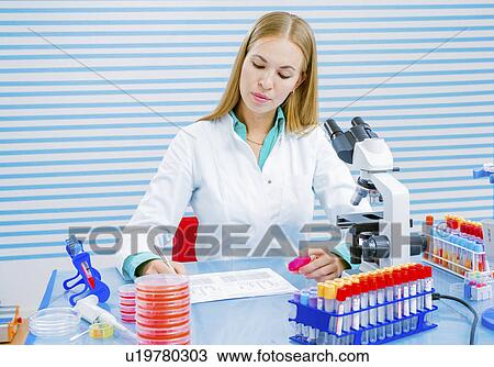 Lab assistant holding sample View Large Photo Image Stock Image - Lab assistant holding sample. Fotosearch