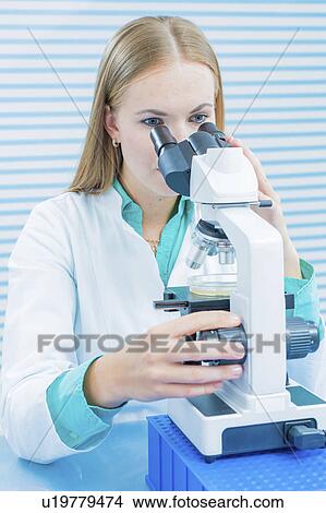 Lab assistant using microscope View Large Photo Image Picture - Lab assistant using microscope. Fotosearch