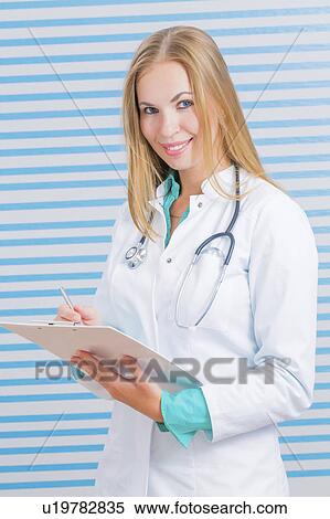 Stock Photography - Lab assistant with clipboard. Fotosearch