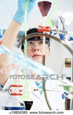Lab technician doing experiment View Large Photo Image Stock Photography - Lab technician doing experiment. Fotosearch