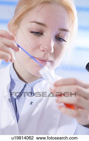 Lab technician holding test tube View Large Photo Image Stock Image - Lab technician holding test tube. Fotosearch