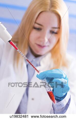 Lab technician holding test tube View Large Photo Image Stock Image - Lab technician holding test tube. Fotosearch
