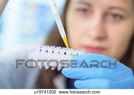 Lab technician holding test tubes View Large Photo Image Stock Image - Lab technician holding test tubes. Fotosearch