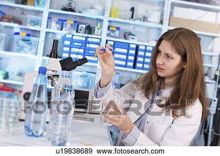 Lab technician testing water in lab View Large Photo Image Stock Photo - Lab technician testing water in lab. Fotosearch