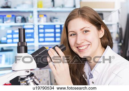 Lab technician using microscope View Large Photo Image Picture - Lab technician using microscope. Fotosearch