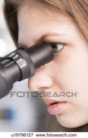 Lab technician using microscope View Large Photo Image Stock Photo - Lab technician using microscope. Fotosearch