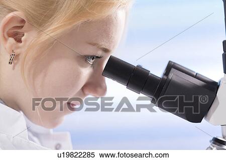 Lab technician using microscope View Large Photo Image Stock Photography - Lab technician using microscope. Fotosearch