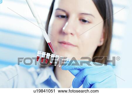 Lab technician using pipette View Large Photo Image Stock Image - Lab technician using pipette. Fotosearch