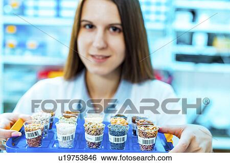 Lab technician with food samples View Large Photo Image Stock Photograph - Lab technician with food samples. Fotosearch