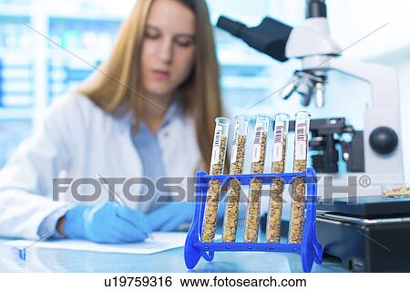 Stock Photograph - Lab technician writing notes. Fotosearch