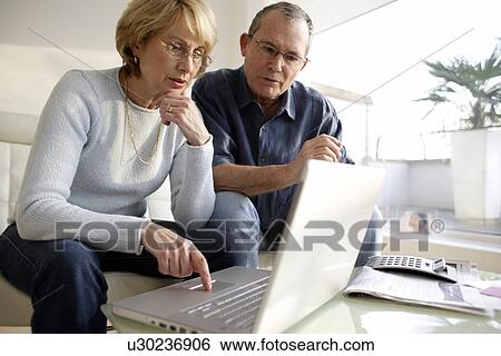 Laptop use View Large Photo Image Stock Photograph - Laptop use. Fotosearch