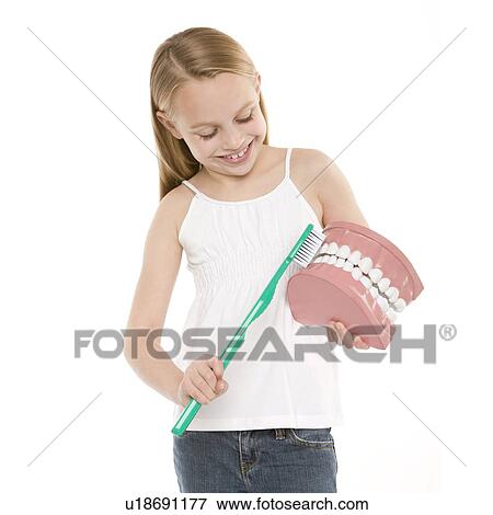Stock Photo - Learning dental hygiene. Fotosearch