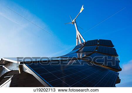 Stock Image - Low angle view of solar energy panel structure and blue sky, Malmo, Sweden. Fotosearch