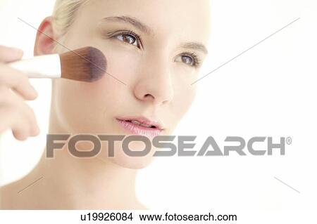 Picture - Make-up application. Fotosearch