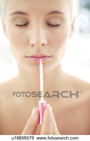 Stock Photo - Make-up application. Fotosearch