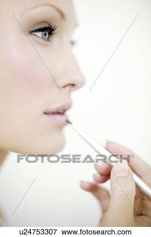 Make-up application View Large Photo Image Stock Photo - Make-up application. Fotosearch