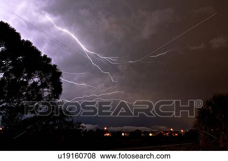 Stock Photo - Mammatus clouds behind the bolts as a lightning crawler shoots across the sky in Rockledge, Florida, USA. Fotosearch