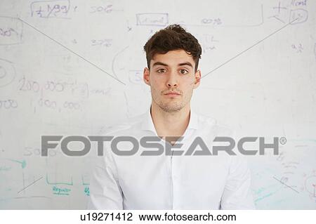Man in front of white board looking at camera View Large Photo Image Stock Image - Man in front of white board looking at camera. Fotosearch