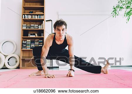 Stock Photograph - Man in martial art stance looking at camera. Fotosearch