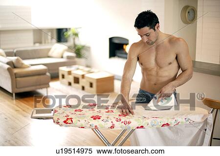 Stock Photography - Man ironing. Fotosearch
