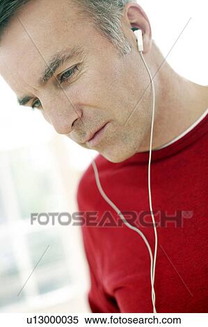 Man listening to music View Large Photo Image Stock Photography - Man listening to music. Fotosearch