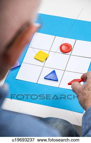 Man playing game View Large Photo Image Stock Photo - Man playing game. Fotosearch