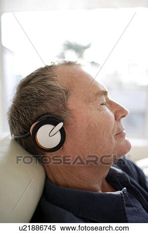 Stock Photography - Man using headphones. Fotosearch