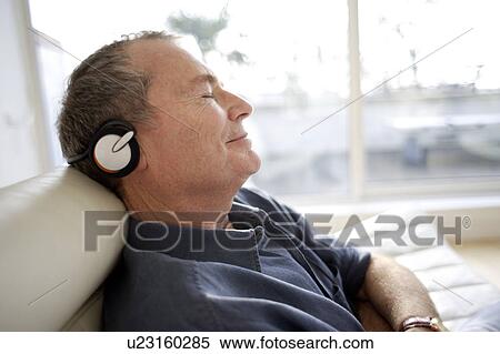 Stock Photography - Man using headphones. Fotosearch