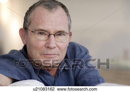 Stock Image - Man wearing glasses. Fotosearch