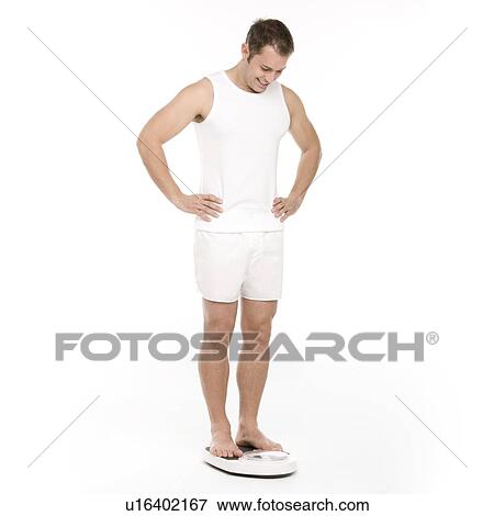 Man weighing himself View Large Photo Image Stock Photo - Man weighing himself. Fotosearch