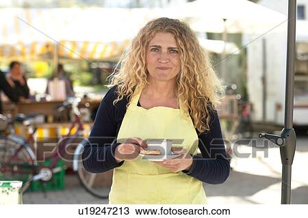 Market trader on coffee break View Large Photo Image Stock Image - Market trader on coffee break. Fotosearch