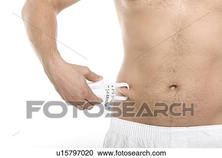 Stock Image - Measuring body fat. Fotosearch