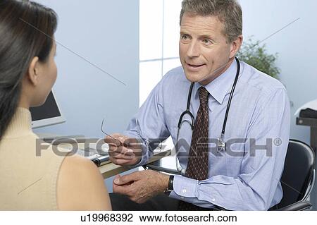 Stock Image - Medical consultation. Fotosearch