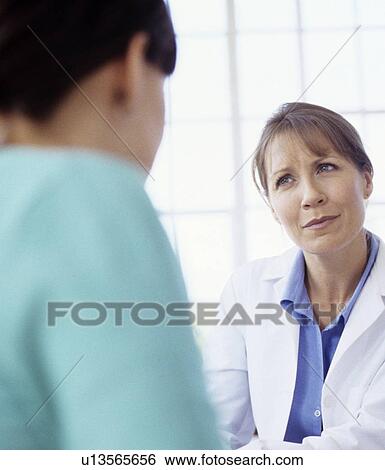 Stock Photograph - Medical consultation. Fotosearch