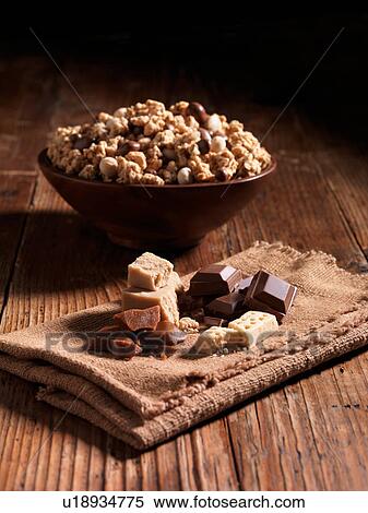 Millionaires caramel crunch in bowl with ingredients beside it View Large Photo Image Stock Photography - Millionaires caramel crunch in bowl with ingredients beside it. Fotosearch