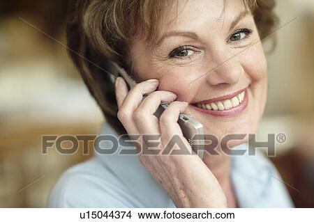 Picture - Mobile phone use. Fotosearch
