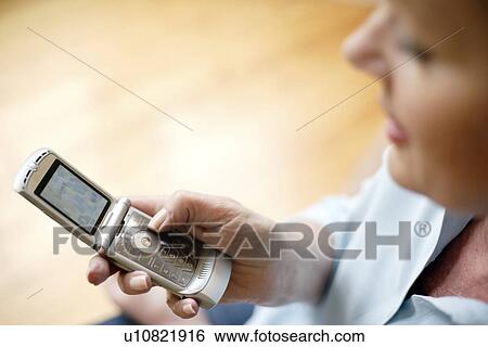 Stock Photograph - Mobile phone use. Fotosearch
