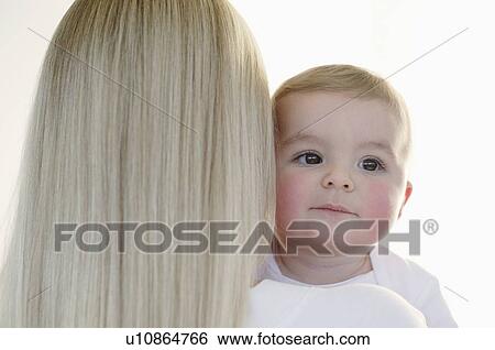 Stock Photograph - Mother and baby. Fotosearch