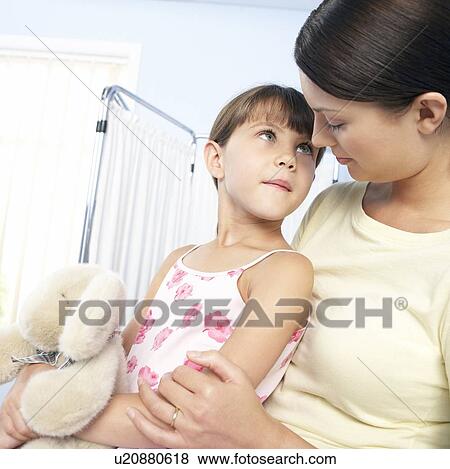 Mother comforting her daughter View Large Photo Image Stock Photo - Mother comforting her daughter. Fotosearch