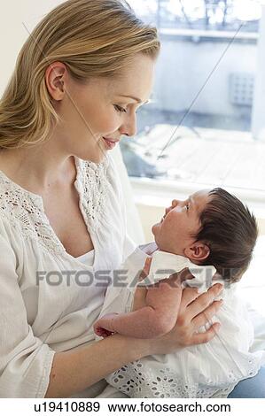 Mother holding baby View Large Photo Image Stock Photo - Mother holding baby. Fotosearch
