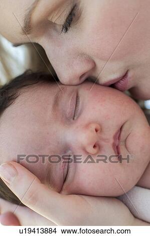 Mother kissing baby View Large Photo Image Picture - Mother kissing baby. Fotosearch