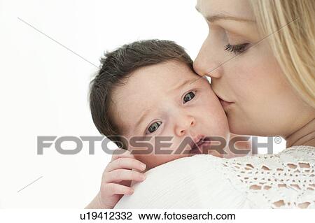 Mother kissing baby View Large Photo Image Stock Image - Mother kissing baby. Fotosearch