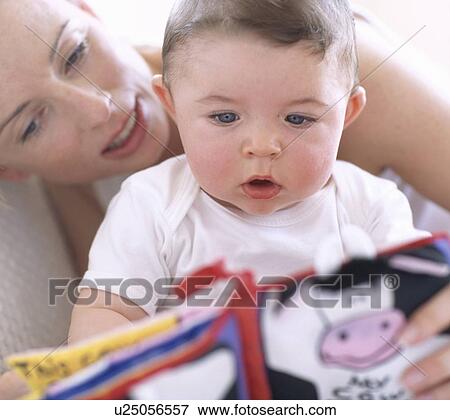 Mother reading to baby boy View Large Photo Image Stock Photo - Mother reading to baby boy. Fotosearch