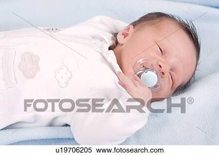 Newborn baby boy with dummy View Large Photo Image Stock Photography - Newborn baby boy with dummy. Fotosearch
