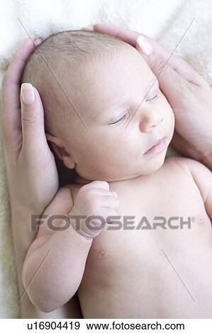 Stock Photo - Newborn baby girl. Fotosearch
