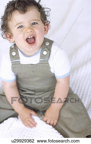 Stock Image - Noisy baby boy. Fotosearch