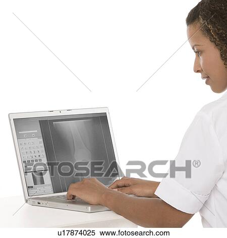 Stock Photography - Nurse using a laptop. Fotosearch